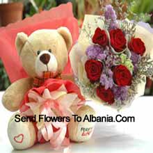 Bunch Of 7 Red Roses And A Medium Sized Cute Teddy Bear Delivered in Albania