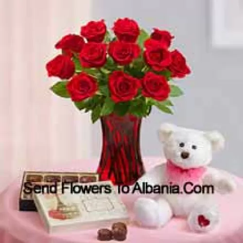 11 Red Roses With Some Ferns In A Glass Vase, A Cute 12 Inches Tall White Teddy Bear And An Imported Box Of Chocolates