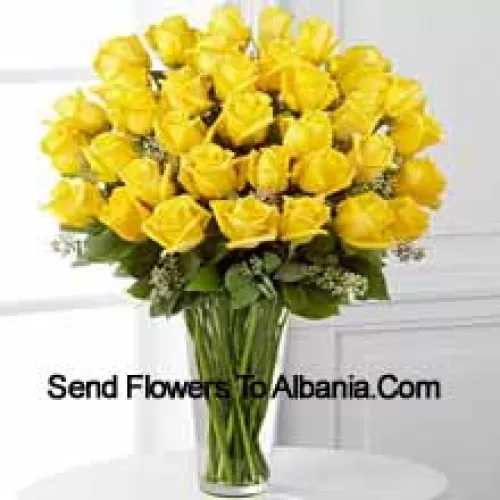 37 Yellow Roses With Some Ferns In A Glass Vase