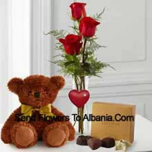 Three Red Roses With Some Ferns In A Vase, A Cute Brown 10 Inches Teddy Bear And A Box Of Godiva Chocolates. (We reserve the right to substitute the Godiva chocolates with chocolates of equal value in case of non-availability of the same. Limited Stock)